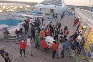 Migrants gather on the bow of the ship.jpg