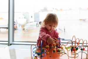little girl playing in airport