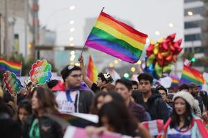 Participants take part in the gay pride parade in Lima