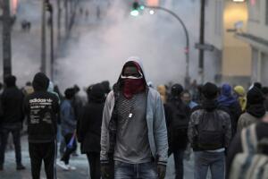 Demonstrators are seen while clashing with riot police during protests after Ecuador's President Lenin Moreno's government ended four-decade-old fuel subsidies, in Quito