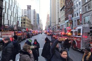 Police and fire crews block off the streets near the New York Port Authority in New York City after reports of an explosion