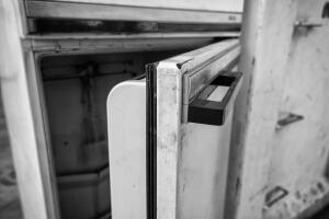 Open fridge in the trash