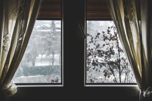 thermal insulation window save energy bills snow fall view winter dark window curtain stay home snowing outside