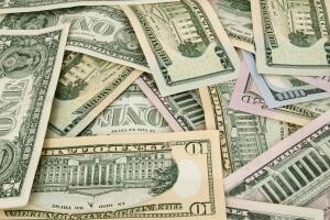 Amarican dollars are scattered with different memorials