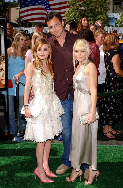 HOLLYWOOD - MAY 1: Actors Mary-Kate Olsen, Bob Saget and Ashley Olsen attend the Los Angeles premiere of the Warner Brothers film "New York Minute" on May 1, 2004 at the Grauman's Chinese Theatre, in Hollywood, California. (Photo by Vince Bucci/Getty Images)