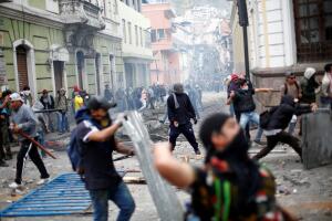 Demonstrators clash with riot police during protests after Ecuador's President Lenin Moreno's government ended four-decade-old fuel subsidies, in Quito