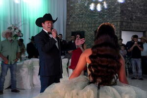 Congressional Democratic candidate Bobby Pulido sings at a quinceanera party in Elsa