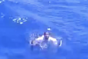 Fisherman relying on water raises his hands up before get murdered at sea