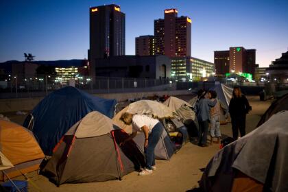 RENO, NV - OCTOBER 6: A tent city for the homeless sits in the shadow of high-rise casinos October 6, 2008 in downtown Reno, Nevada. The City of Reno has set up a tent city when existing shelters became overcrowded as Nevada struggles with one of the highest unemployment rates in the country. Today, Reno is evicting male residents of the tent city, and housing them in a shelter in the nearby city of Sparks. (Photo by Max Whittaker/Getty Images)