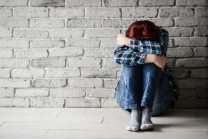 Depressed young crying woman - victim