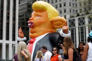 A giant inflatable rat in the likeness of U.S. President Donald Trump is displayed near Trump Tower in New York