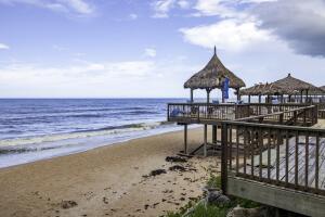 For many, going on vacation means enjoying the covered deck overlooking the Atlantic Ocean at New Smyrna Beach, Florida
