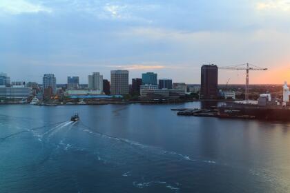 Ships, boats, paddleboats, tugboats, sailboats in sunrise near Chesapeake and Elizabeth Rivers and bay Virginia. Portsmouth and Norfolk Virginia