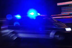 A police car with lights flashing is pic