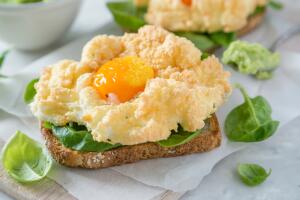 Trendy healthy eating concept - egg clouds on toasts