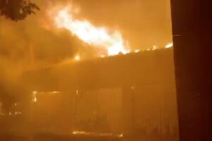 A house on fire is seen during wildfires in San Bernardino, California