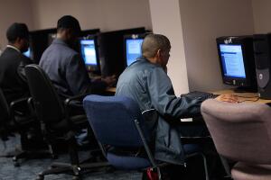 Job Seekers Look For Employment In Brooklyn Career Center