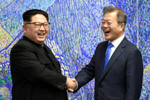 South Korean President Moon Jae-in shakes hands with North Korean leader Kim Jong Un during their meeting at the Peace House