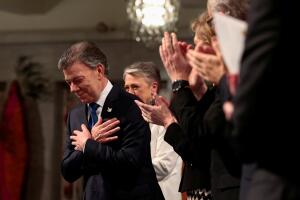 Nobel Peace Prize laureate Colombian President Juan Manuel Santos reacts during the Peace Prize awarding ceremony at the City Hall in Oslo
