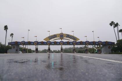 The entrance to the Walt Disney theme park is seen as the park is closed as Hurricane Ian bears down on Florida, Wednesday, Sept. 28, 2022, in Lake Buena Vista, Fla. (AP Photo/John Raoux)