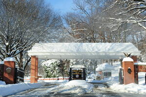 The snow covered gate at  the entrance t