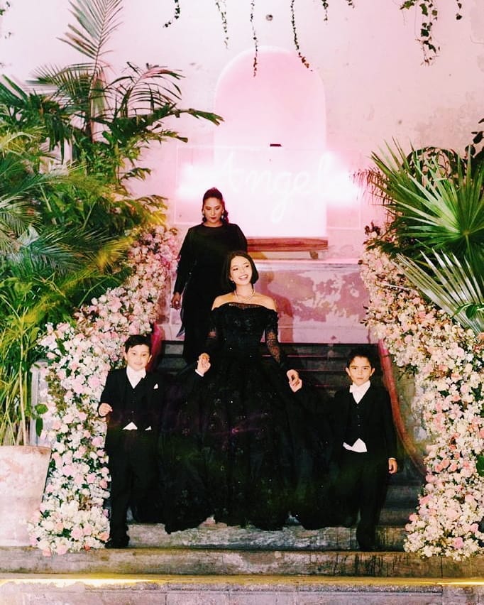 Con cuatro vestidos incluido uno negro Angela Aguilar festejo su fiesta de XV anos Univision Famosos Univision